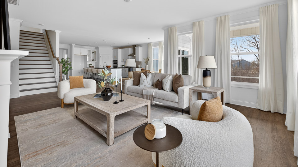 open concept living space with large windows, fireplace