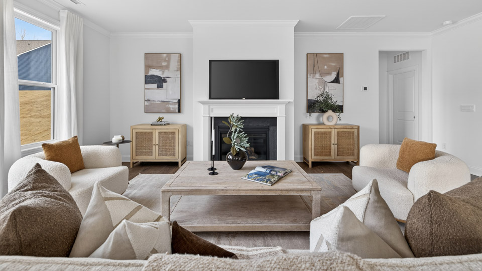 open concept living space with large windows, fireplace
