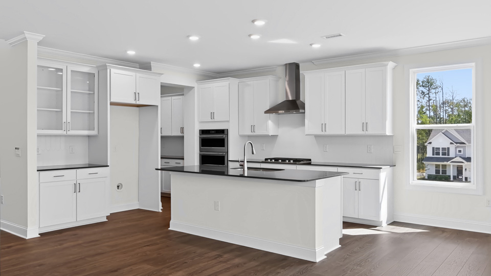 kitchen with quartz countertops white cabinets and spacious island