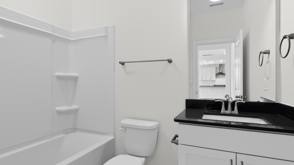bathroom with tub shower combo and quartz countertops
