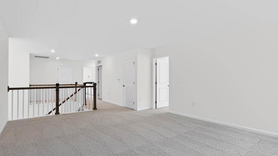 top of stairs at carpeted loft