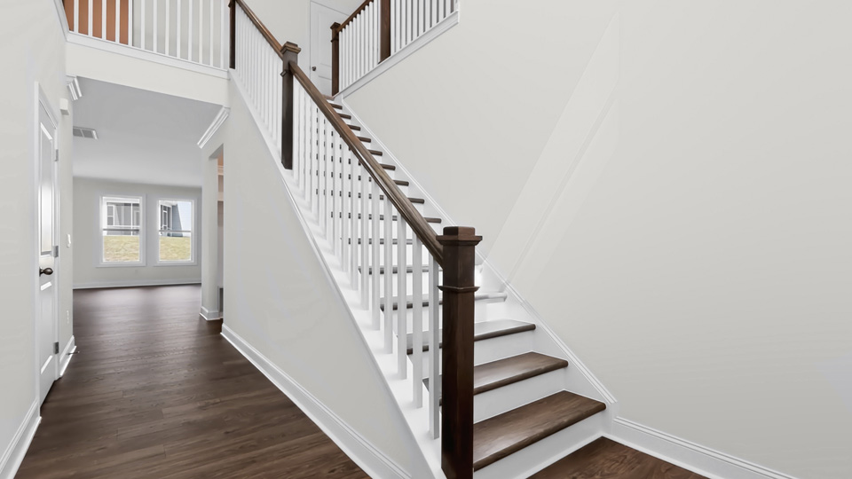 bottom of staircase at entry front door
