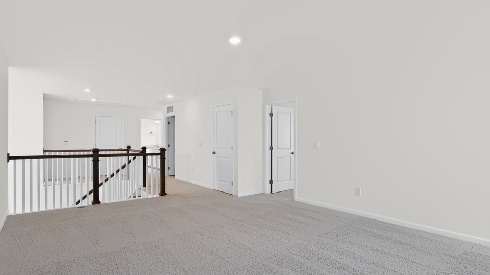 top of stairs at carpeted loft