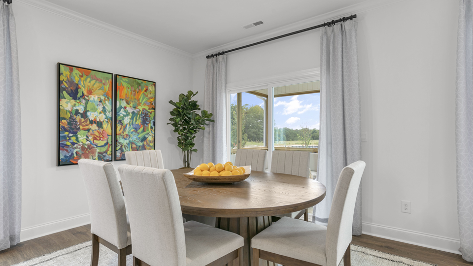 open concept dining space with door to patio