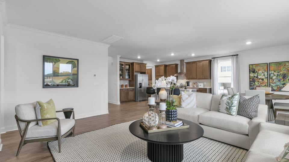 open concept living space with large windows, fireplace
