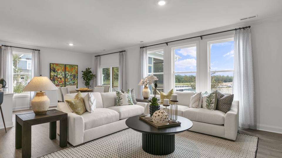 open concept living space with large windows, fireplace
