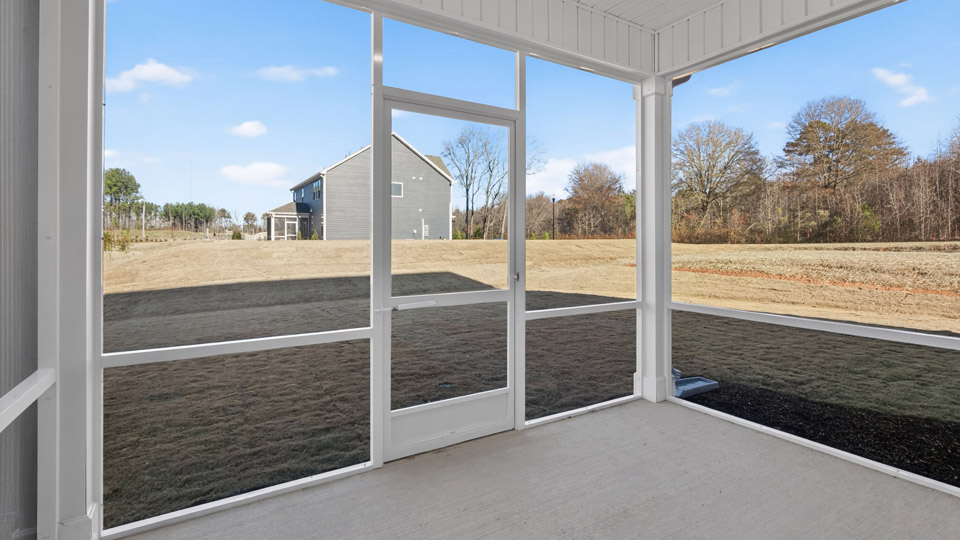 Covered back patio overlooking backyard