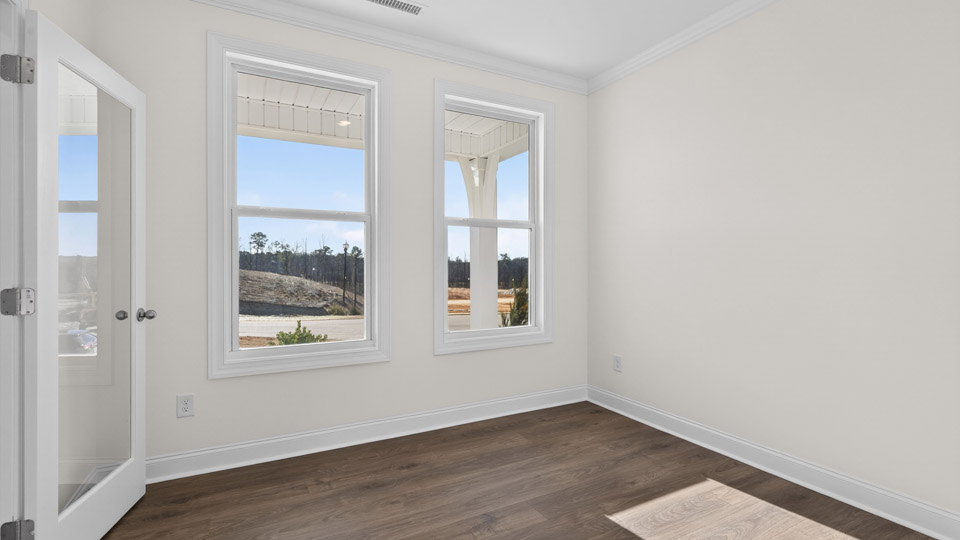 Study room with hardwood floors and big windows
