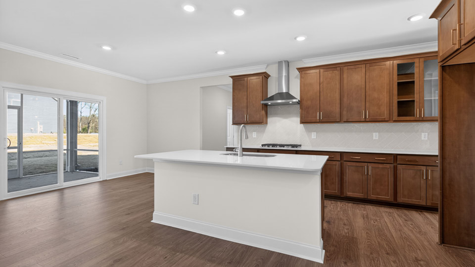 Kitchen with wood cabinets and stainless steel appliances.
