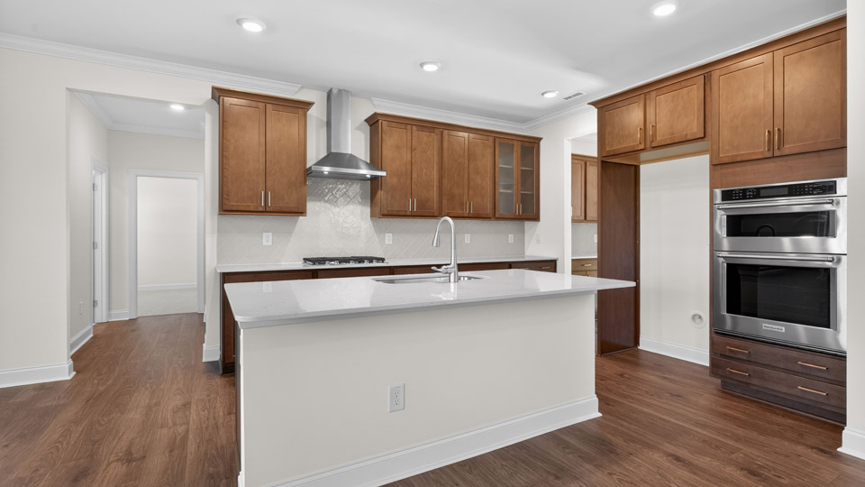 Kitchen with wood cabinets and stainless steel appliances.