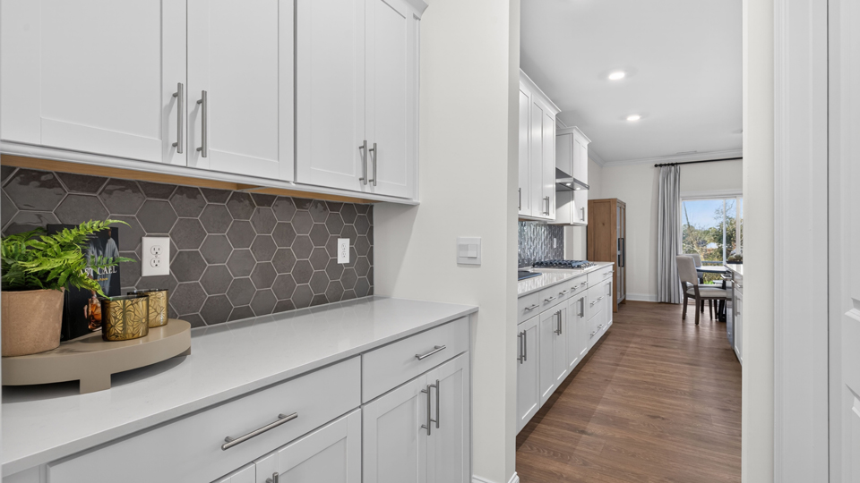 Kitchen with white cabinets and stainless steel appliances.