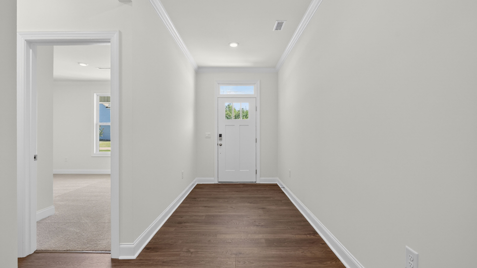 foyer entryway with revwood flooring