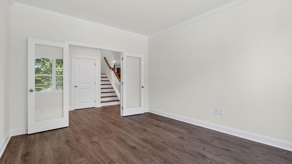 study with french doors and revwood flooring
