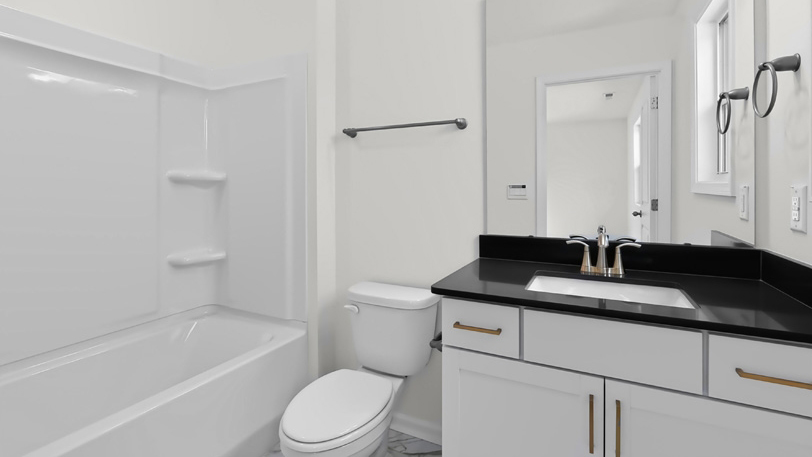 bathroom with tub shower combo