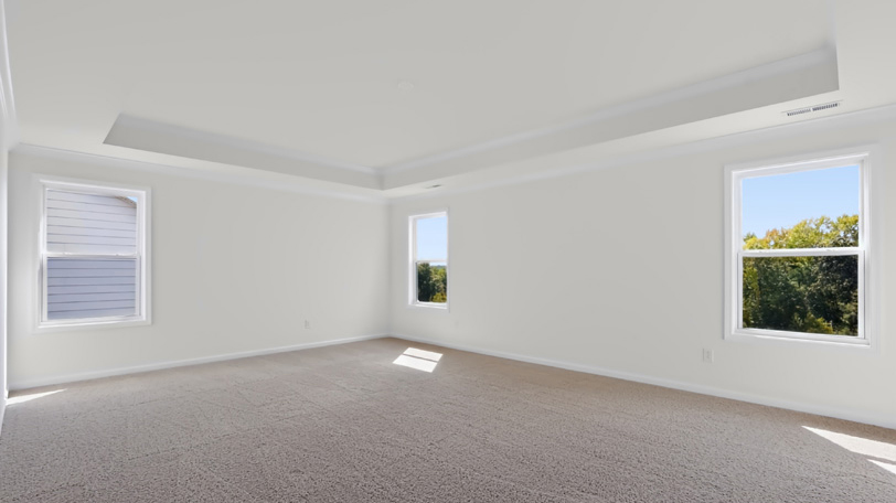 primary bedroom with carpet flooring