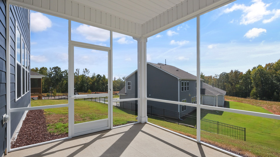 covered and screened in back patio