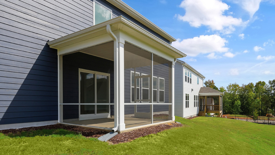 covered and screened in back patio