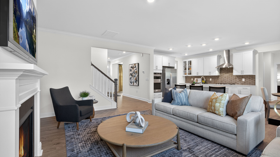 open concept living space with large windows, fireplace
