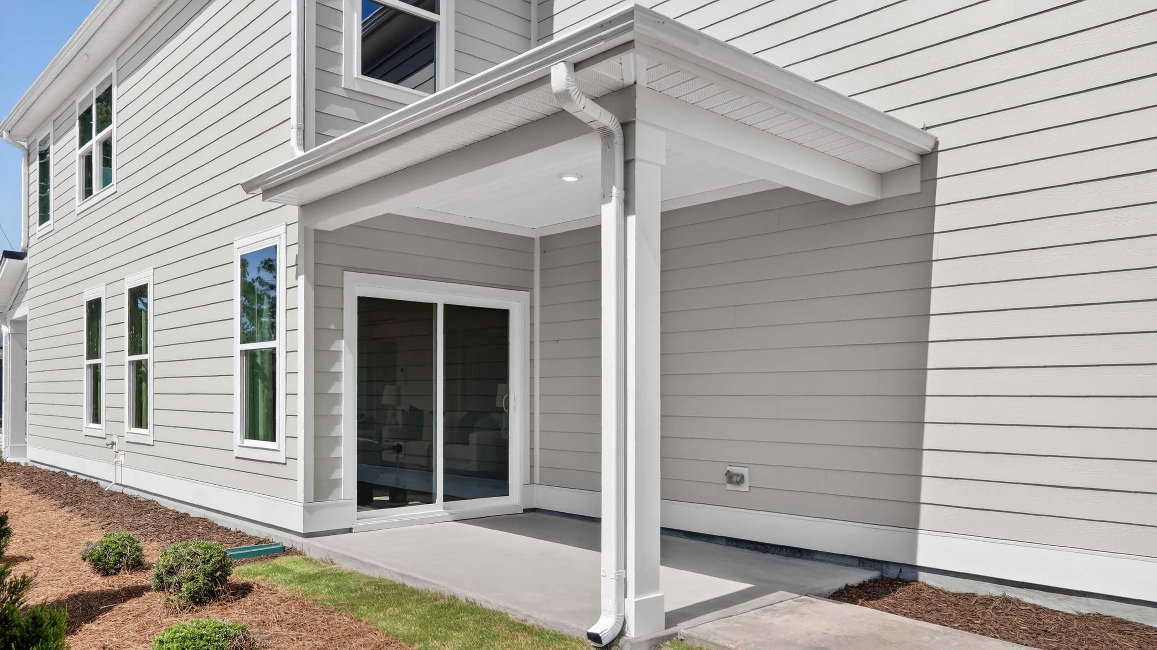 covered patio with sliding glass doors