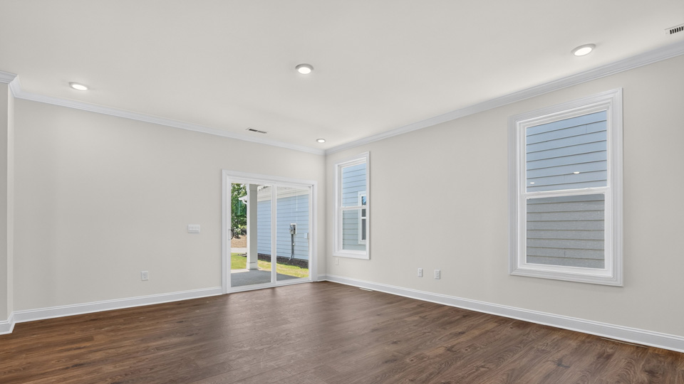 LIVING ROOM AND REAR PATIO DOOR