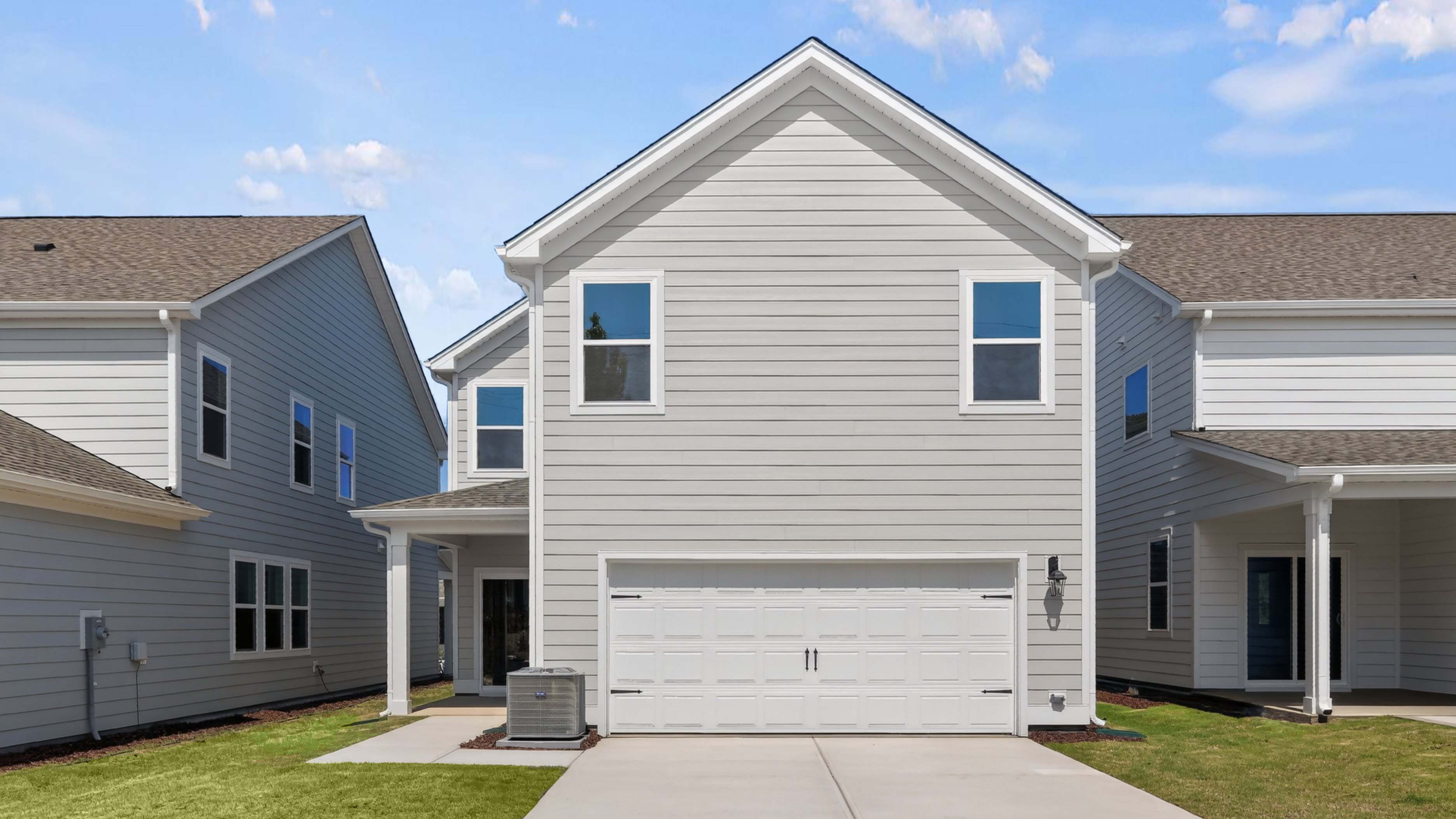 REAR EXTERIOR AND REAR LOADING GARAGE DOOR