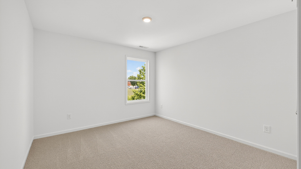 additional bedroom with window, carpeting, closet