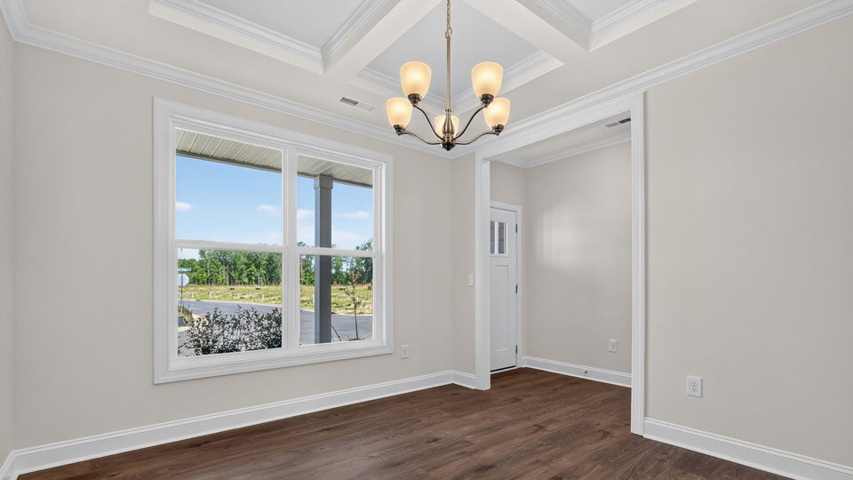 dining room with coffered ceiling