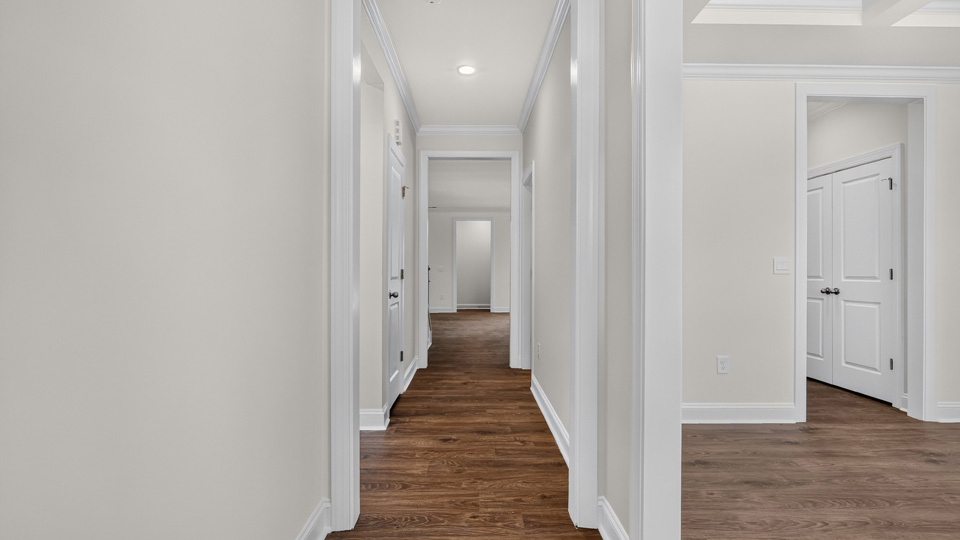 foyer entryway with powder room on right