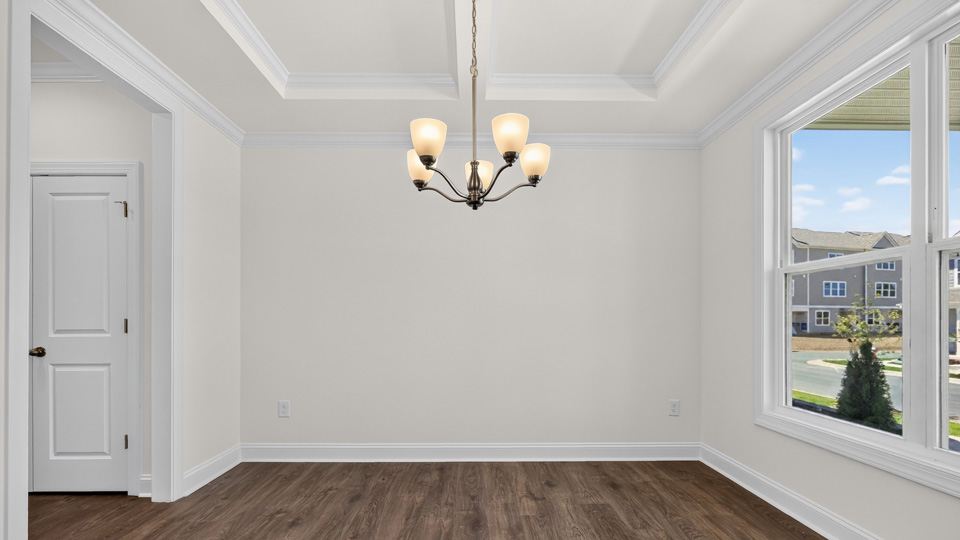 dining room with coffered ceiling