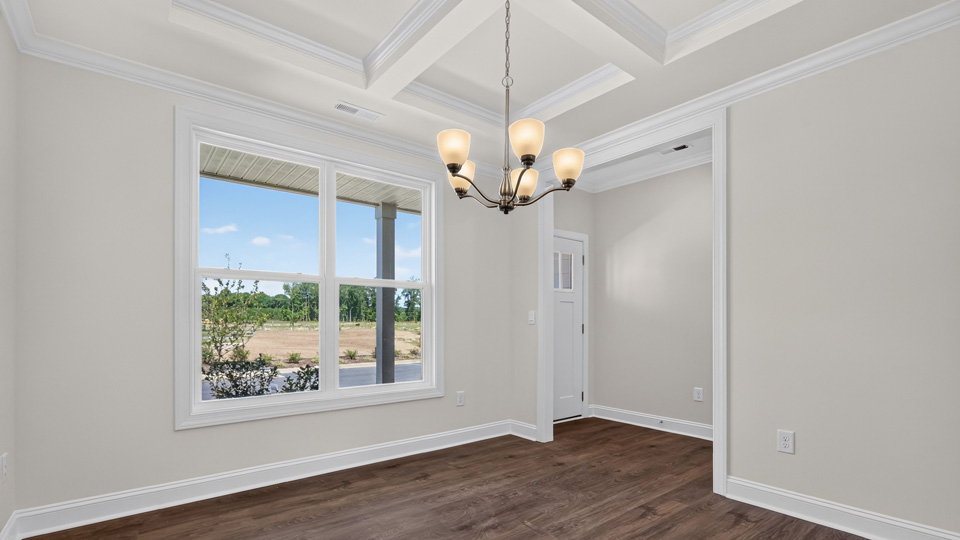 dining room with coffered ceiling
