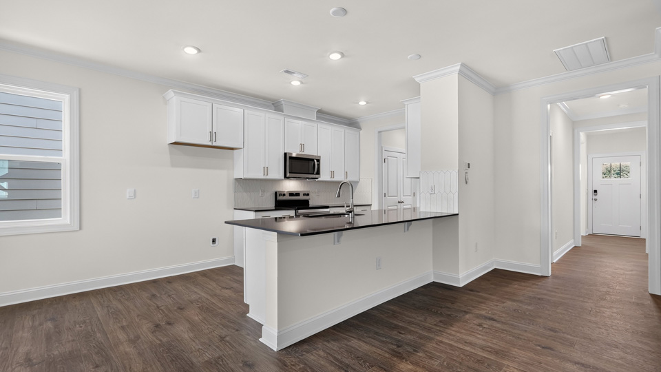 kitchen with island quartz countertops and white cabinets