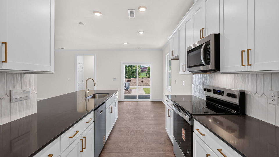 kitchen with island quartz countertops and white cabinets