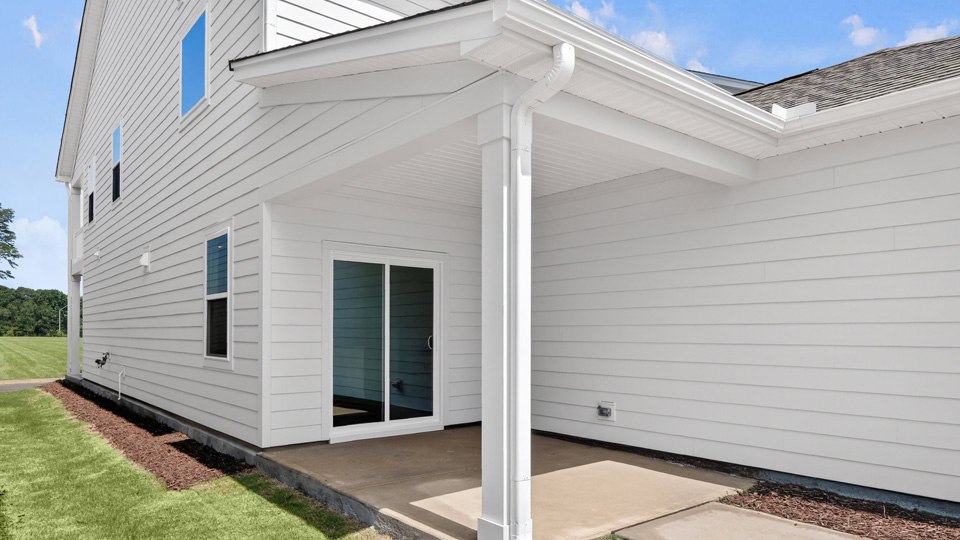 covered back patio with sliding glass doors