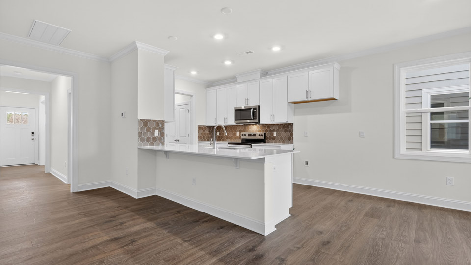 Kitchen with white cabinets and stainless steel appliances.
