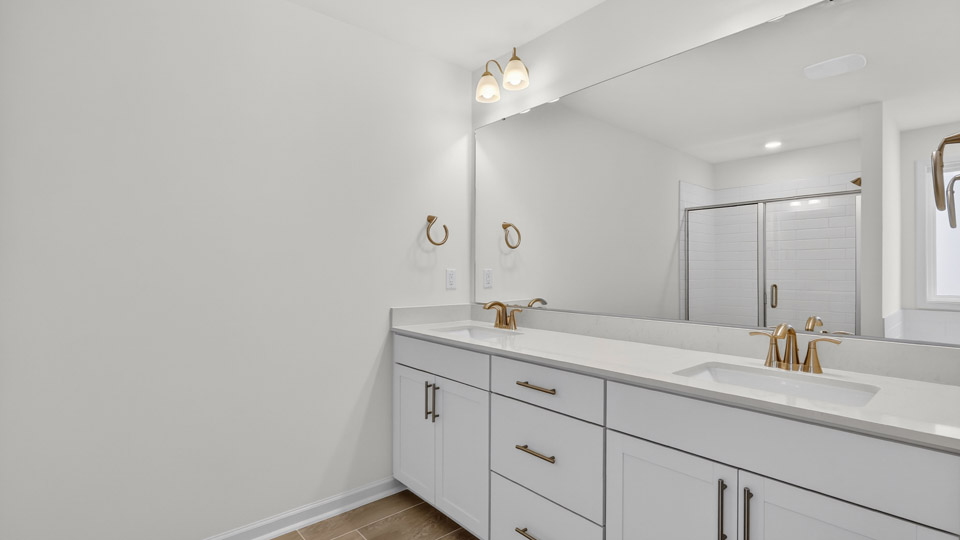 Bathroom with double sink and shower