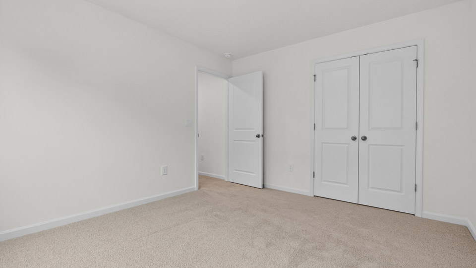 Bedroom with carpet floor and closet
