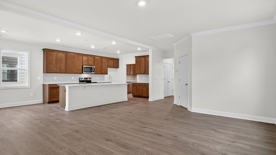 Kitchen with brown cabinets and stainless steel appliances.