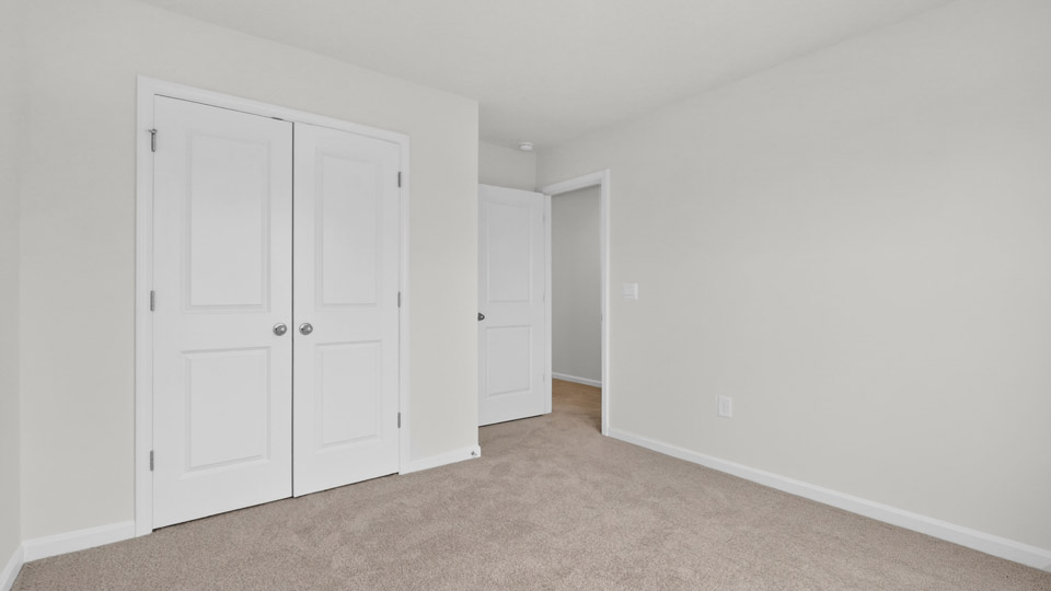 Bedroom with carpet floor and closet