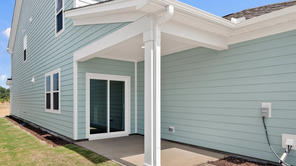 covered patio with sliding glass doors