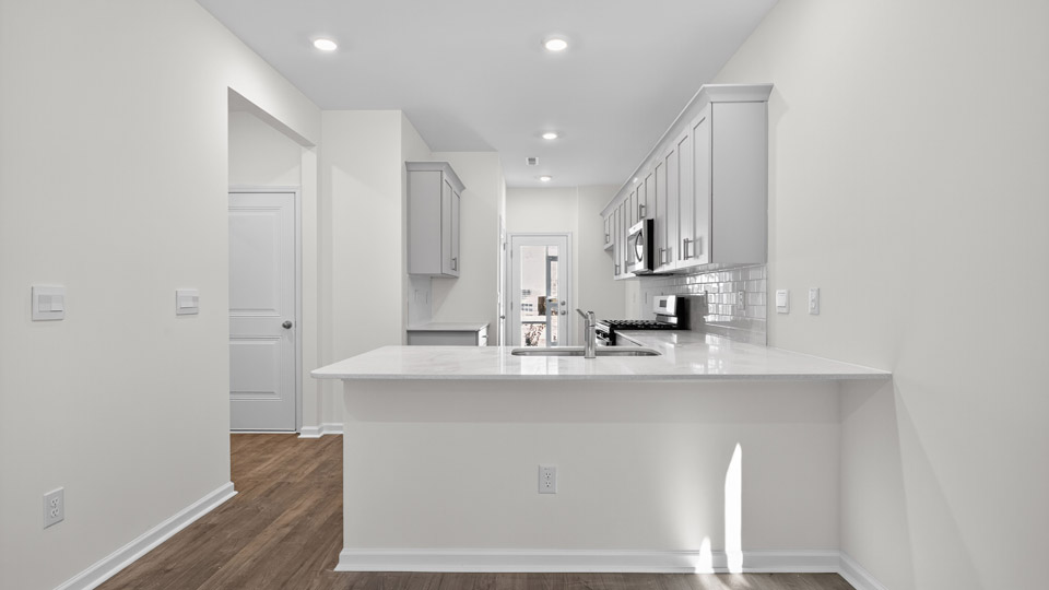 Kitchen with white cabinets and stainless steel appliances.