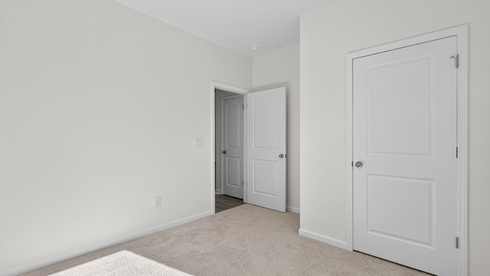 Bedroom with carpet floor and closet