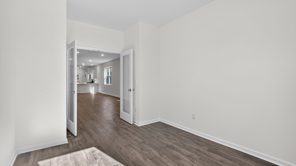 Study room with hardwood floors and big windows