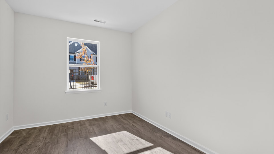 Study room with hardwood floors and big windows