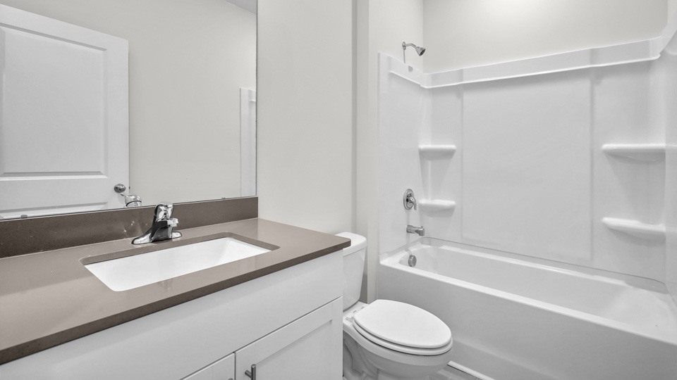 Bathroom with white cabinets