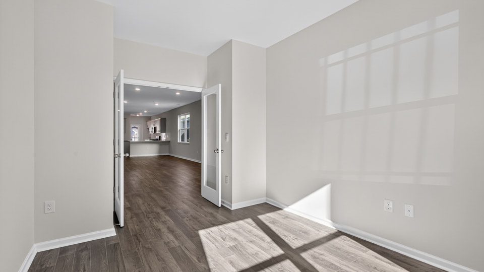 Study room with hardwood floors and big windows
