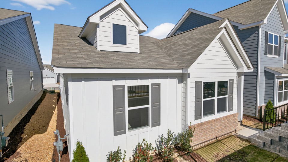 Single story home with white siding