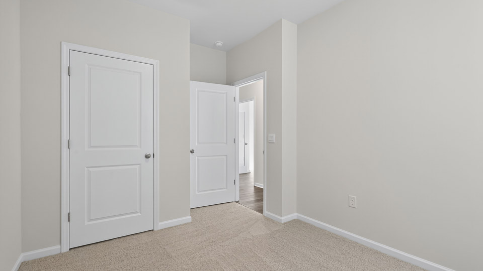 Bedroom with carpet floor and closet