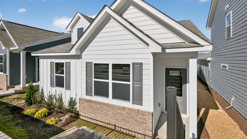 Single story home with white siding