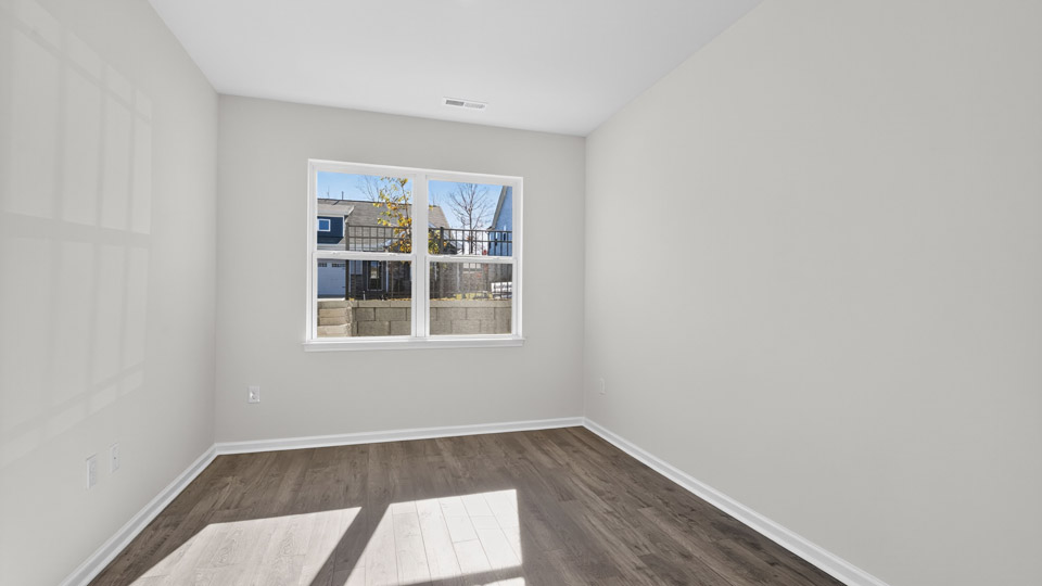 Study room with hardwood floors and big windows