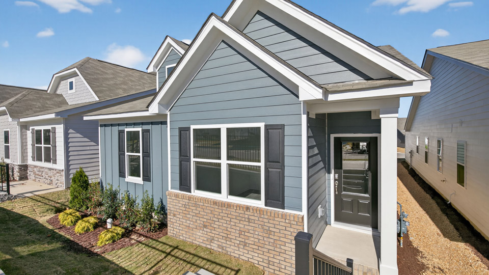 Single story home with blue siding